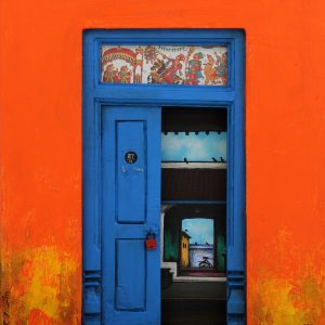 Blue wooden door sculpture by artist Santhana Krishnan This artwork revolves around the entrance of a home…the doors
